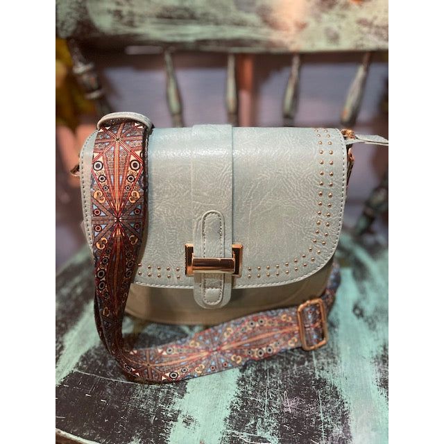 Crossbody with stud details and printed guitar strap